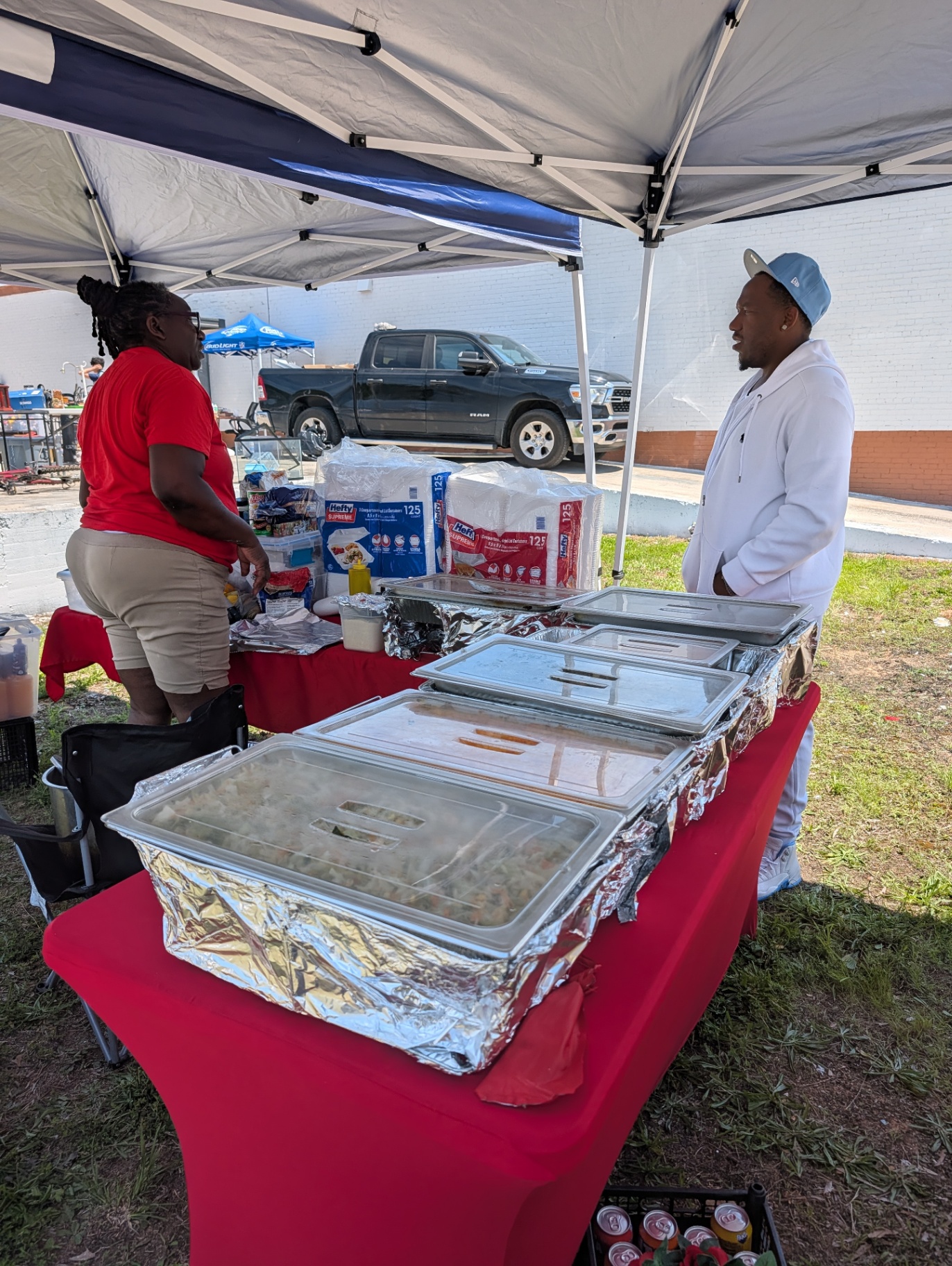 Local food vendor serving plates at the marketplace